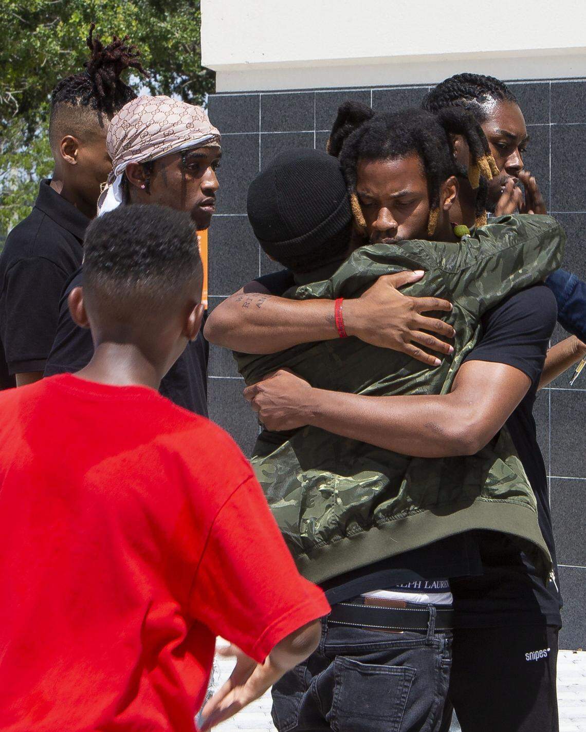 Rapper Denzel Curry hugs a fan outside the BB&T Center before the memorial service for fellow slain rapper, XXXTentacion, in Sunrise, FL, on Wednesday, June 27, 2018. Curry and XXXTentacion were both business partners and friends, even living together for a period of time in South Florida.