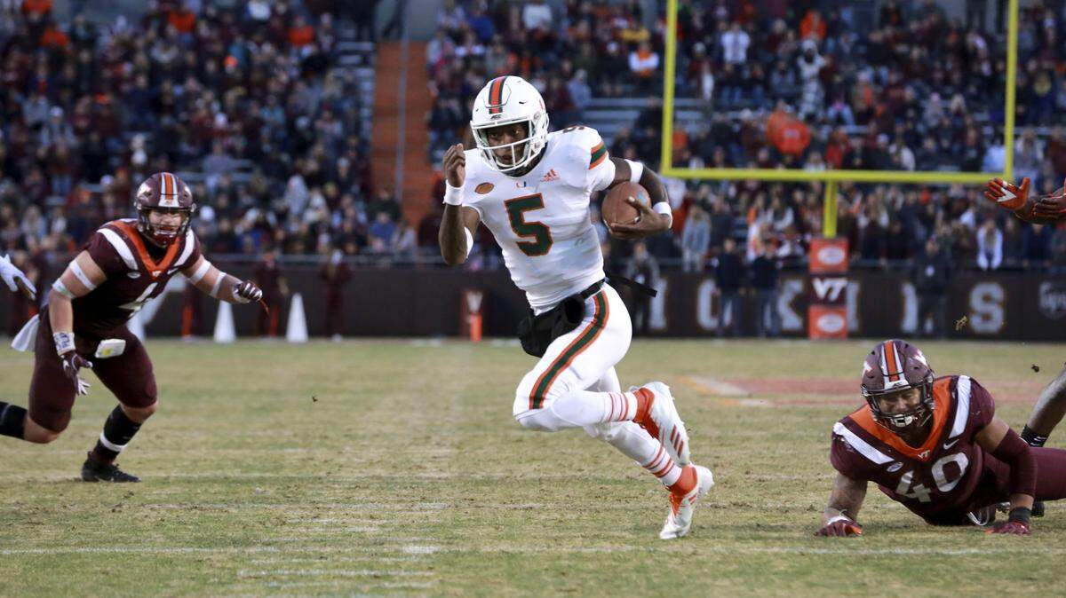 Miami quarterback N’Kosi Perry (5) runs to the 1 yard line in the first half of Saturday’s game at Virginia Tech.