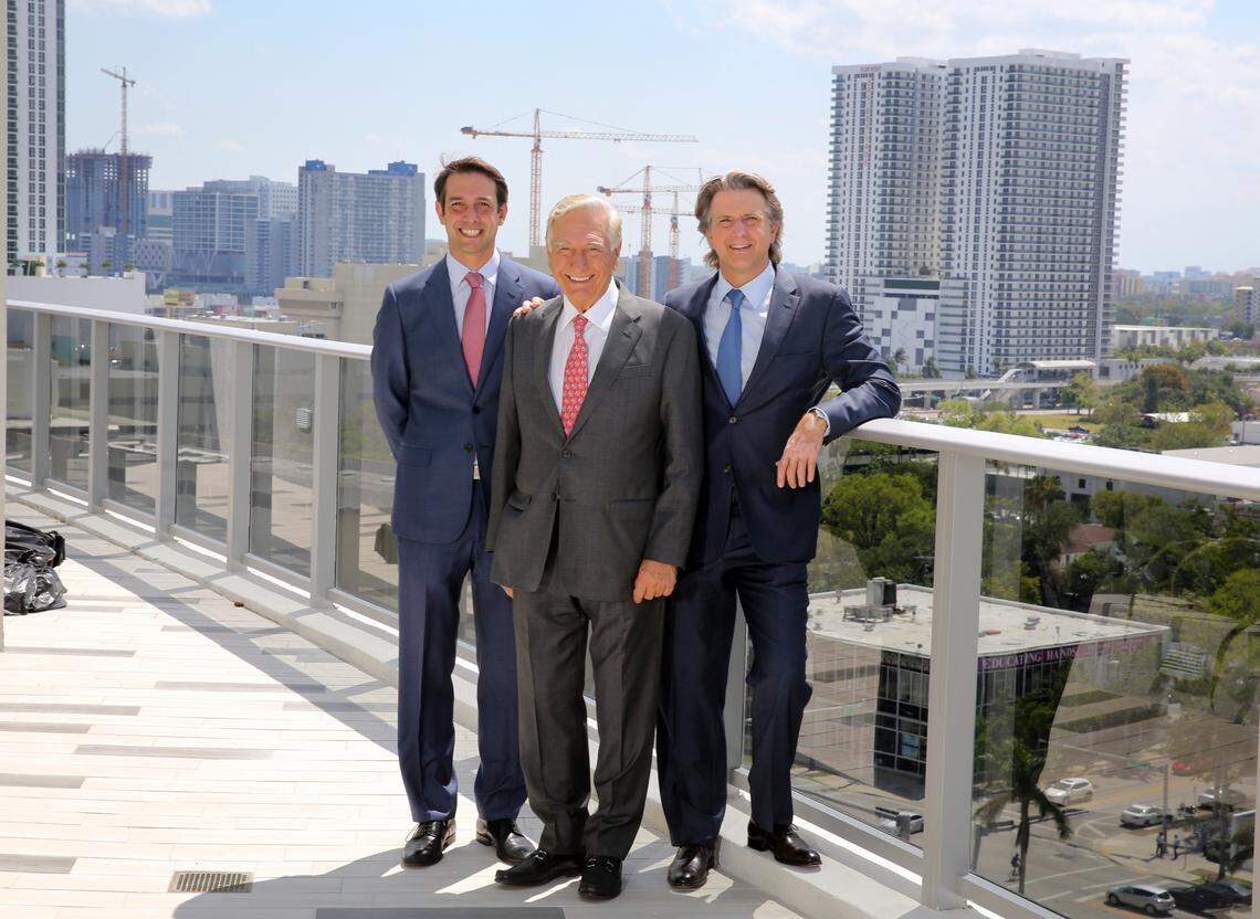 The Melo Group, Dr. Jose Luis Ferreira de Melo (center) and his two sons, Martin (L) and Carlos (R) stand on the 14th floor pool deck of the brand new Aria on the Bay in Edgewater Monday, April 30, 2018. The cranes behind them are building their downtown Miami project called Art Plaza and the buildings to the right of the cranes are their Square Station development. 