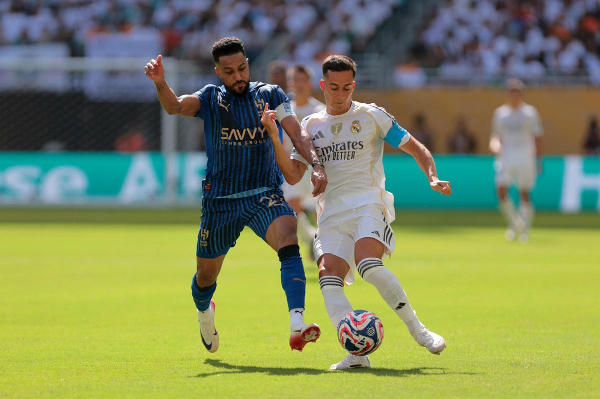 Jun 18, 2025; Miami Gardens, Florida, USA; Real Madrid CF defender Lucas Vazquez (17) and Al Hilal FC midfielder Salem Aldawsari (29) battle for the ball in the second half during a group stage match of the 2025 FIFA Club World Cup at Hard Rock Stadium. Mandatory Credit: Sam Navarro-Imagn Images