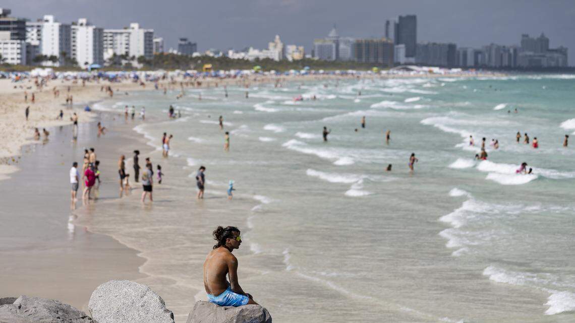 People visit South Pointe Beach during spring break on Saturday, March 15, 2025, in Miami Beach, Fla.