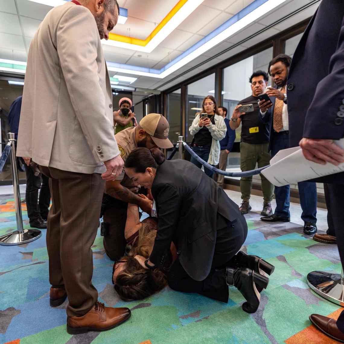 Camila Ramos is arrested after being forcibly removed from the commission chambers by officers during a Miami-Dade County Commission meeting at the Stephen P. Clark Government Center on Thursday, June 26, 2025, in Miami.