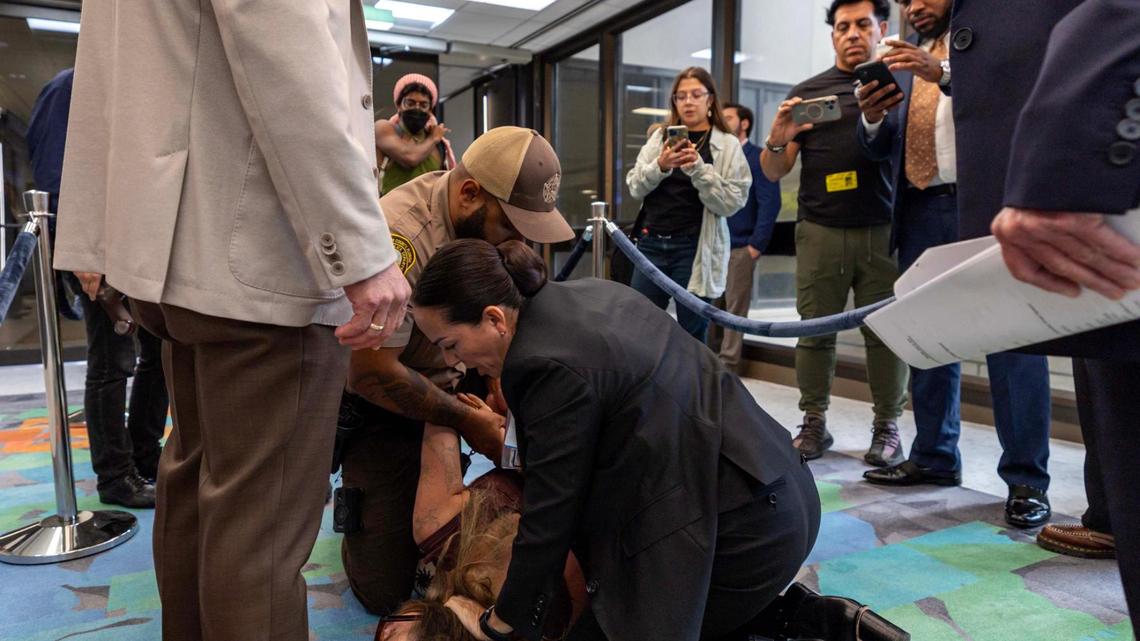 Camila Ramos is arrested after being forcibly removed from the commission chambers by officers during a Miami-Dade County Commission meeting at the Stephen P. Clark Center on Thursday, June 26, 2025, in Miami.