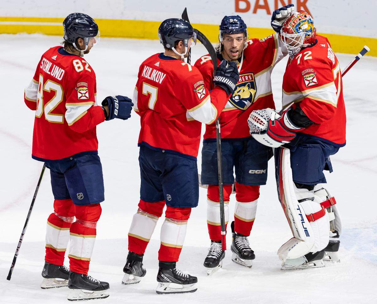 Florida Panthers goaltender Sergei Bobrovsky (72) celebrates with left wing Ryan Lomberg (94), defenseman Dmitry Kulikov (7) and center Kevin Stenlund (82) after they defeated the Dallas Stars in their NHL game at the Amerant Bank Arena on Wednesday, Dec. 6, 2023, in Sunrise, Fla.