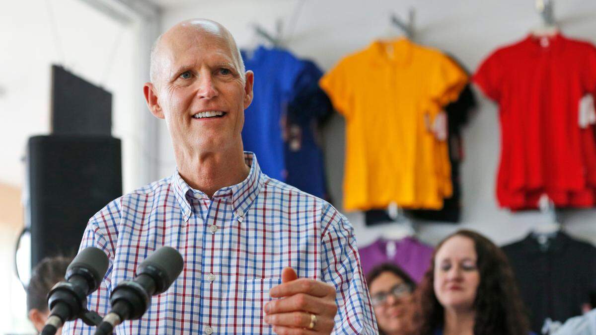 Florida Gov. Rick Scott speaks during a news conference at LR Uniforms in Miami to highlight the Back-To-School Sales Tax Holiday, Wednesday, Aug. 1, 2018.