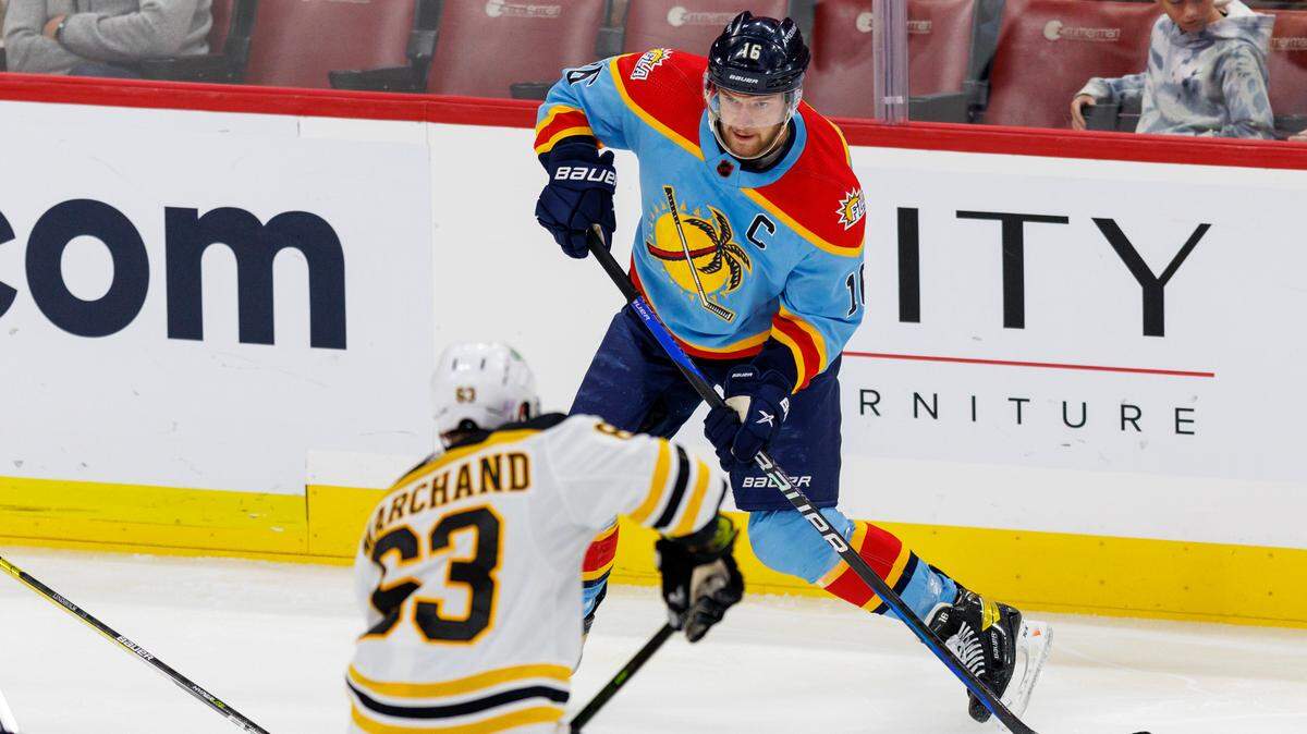 Florida Panthers center Aleksander Barkov (16) passes the puck against Boston Bruins left wing Brad Marchand (63) during the first period of an NHL game at FLA Live Arena on Wednesday, November 23, 2022 in Sunrise, Fl.