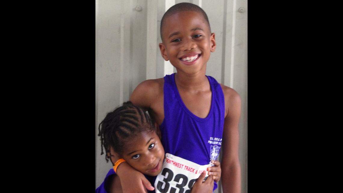 Avril-Renee Montgomery, 4, and brother, Zachary, 7, like the way things are going at the Northwest Express Track Classic on Sunday.