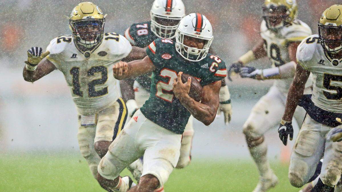 Miami Hurricanes running back Travis Homer (24) runs towards the end zone to score in the fourth quarter as the University of Miami hosts Georgia Tech at Hard Rock Stadium on Saturday, October 14, 2017.  Homer was nominated on Wednesday, July 18, 2018, for the prestigious Doak Walker Award.
