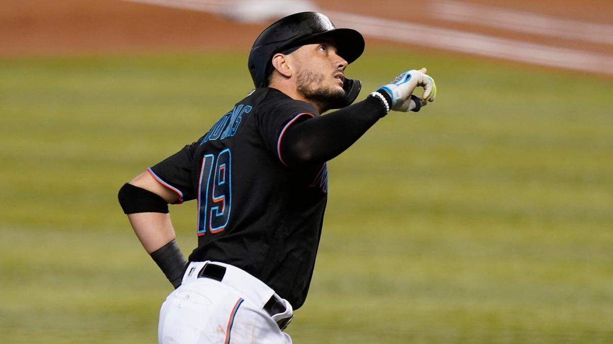 Miami Marlins’ Miguel Rojas (19) rounds the bases on a solo home run during the first inning of a baseball game against the Milwaukee Brewers, Saturday, May 8, 2021, in Miami.