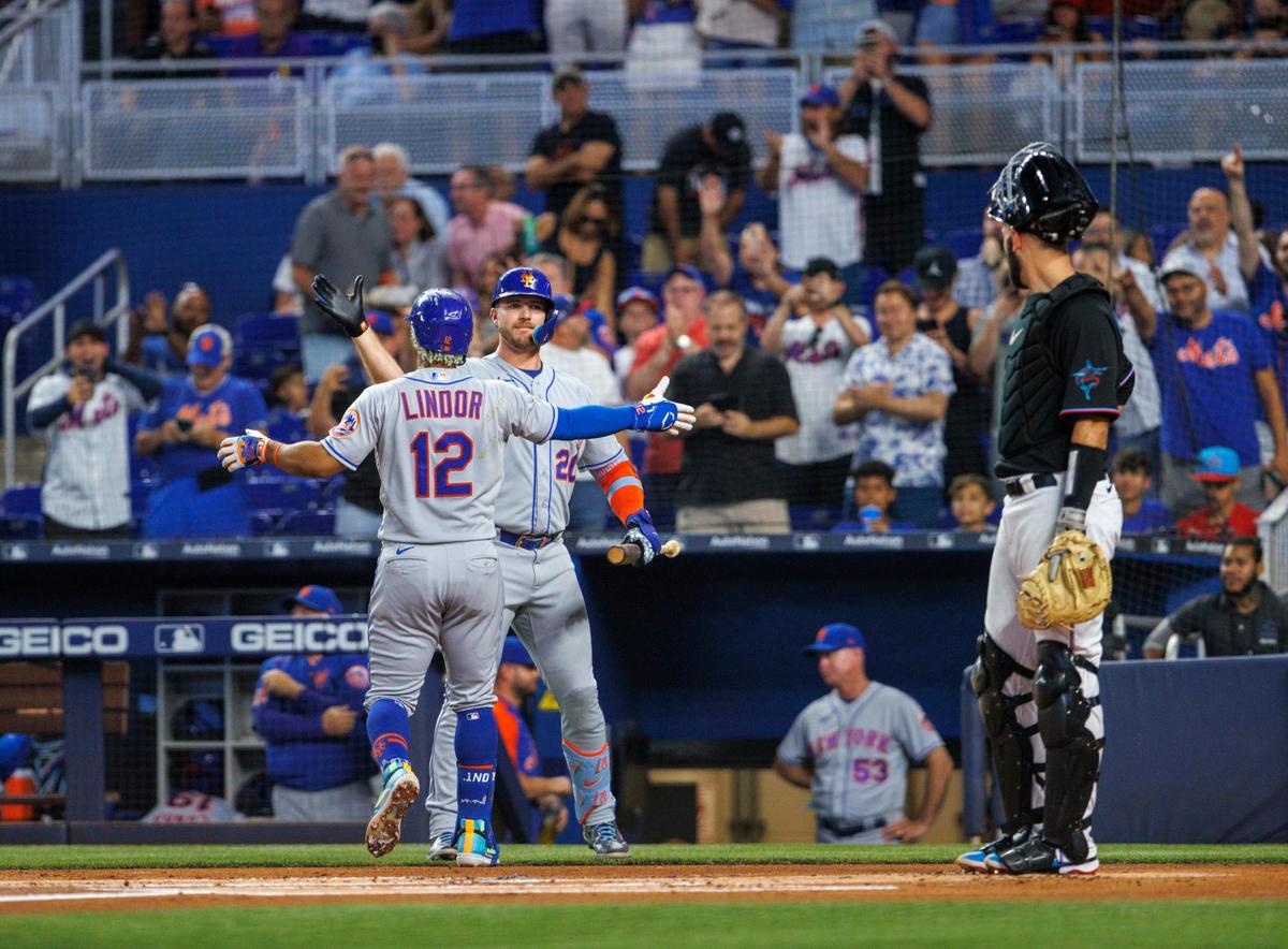 New York Mets shortstop Francisco Lindor (12) celebrates with Pete Alonso (20) after hitting a solo home run during the first inning of a baseball game against the Miami Marlins at LoanDepot Park on Friday, June 24, 2022 in Miami, Florida.