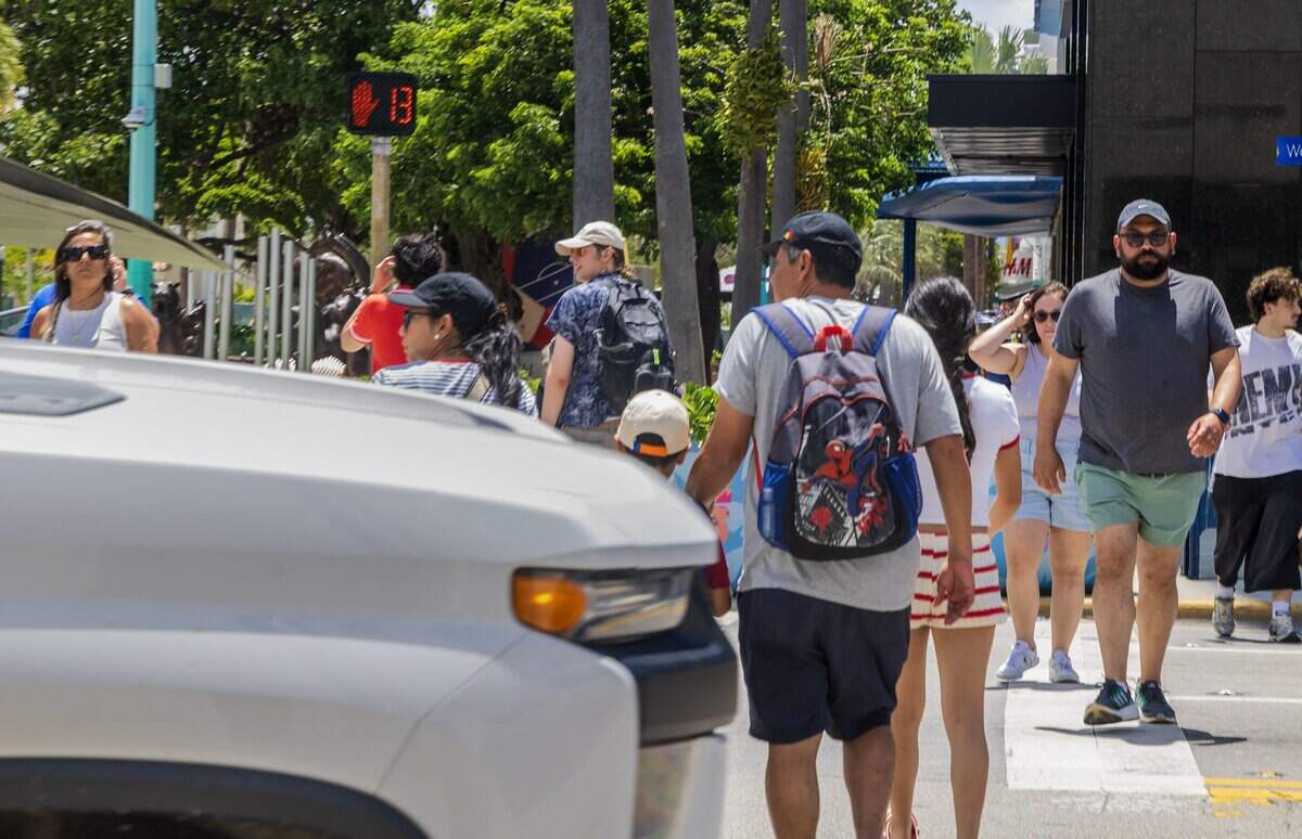 A truck passes as pedestrians crosses the street intersection at Lincoln Road and Washington Avenue, a hotspot where pedestrians get hit and seriously injured or killed, on Thursday June 11, 2026.