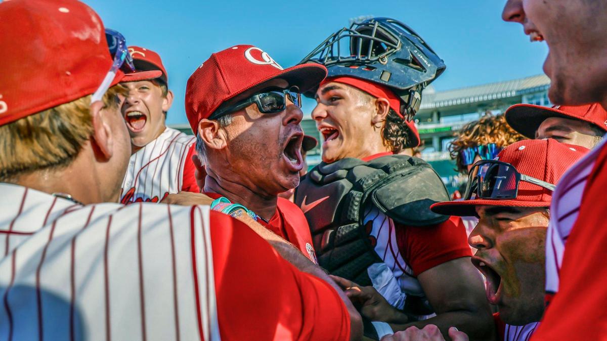 Cardinal Gibbons Chiefs head coach Jason Hamilton celebrates with the team after defeating the Mulberry Panthers during the FHSAA Baseball Class 4A State Semifinal at Hammond Stadium in Fort Myers, Florida on Tuesday, May 21, 2024.