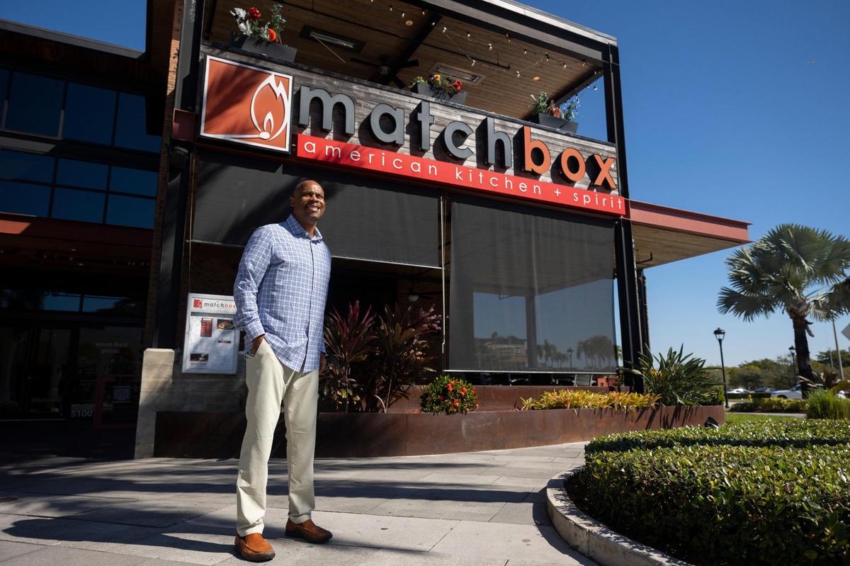 Warren Thompson, founder of Thompson Hospitality, poses in front of his company’s Matchbox restaurant on Wednesday, Jan. 31, 2024, at Sawgrass Mills in Sunrise. Thompson started the company in 1992 after working at Marriott.