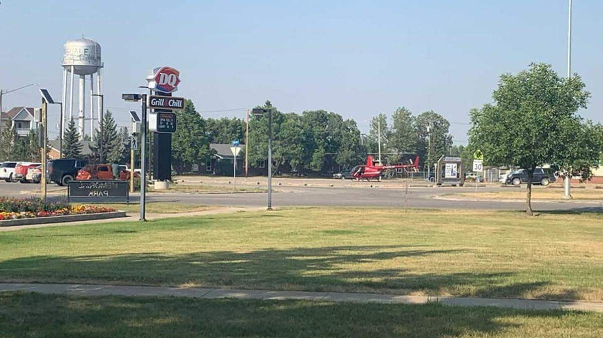 The pilot of a helicopter that landed in a school parking lot in Tisdale, Canada, to buy an ice cream cake at Dairy Queen faces charges, police say.