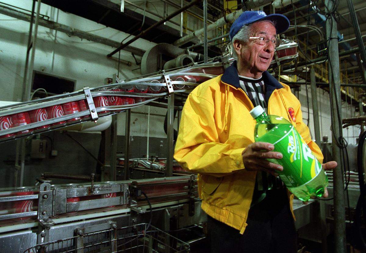 In this file photo from Nov. 22, 2000, Nick Caporella, of Beverage Canners Intl., holds a bottle of the Ritz product in the bottling plant.