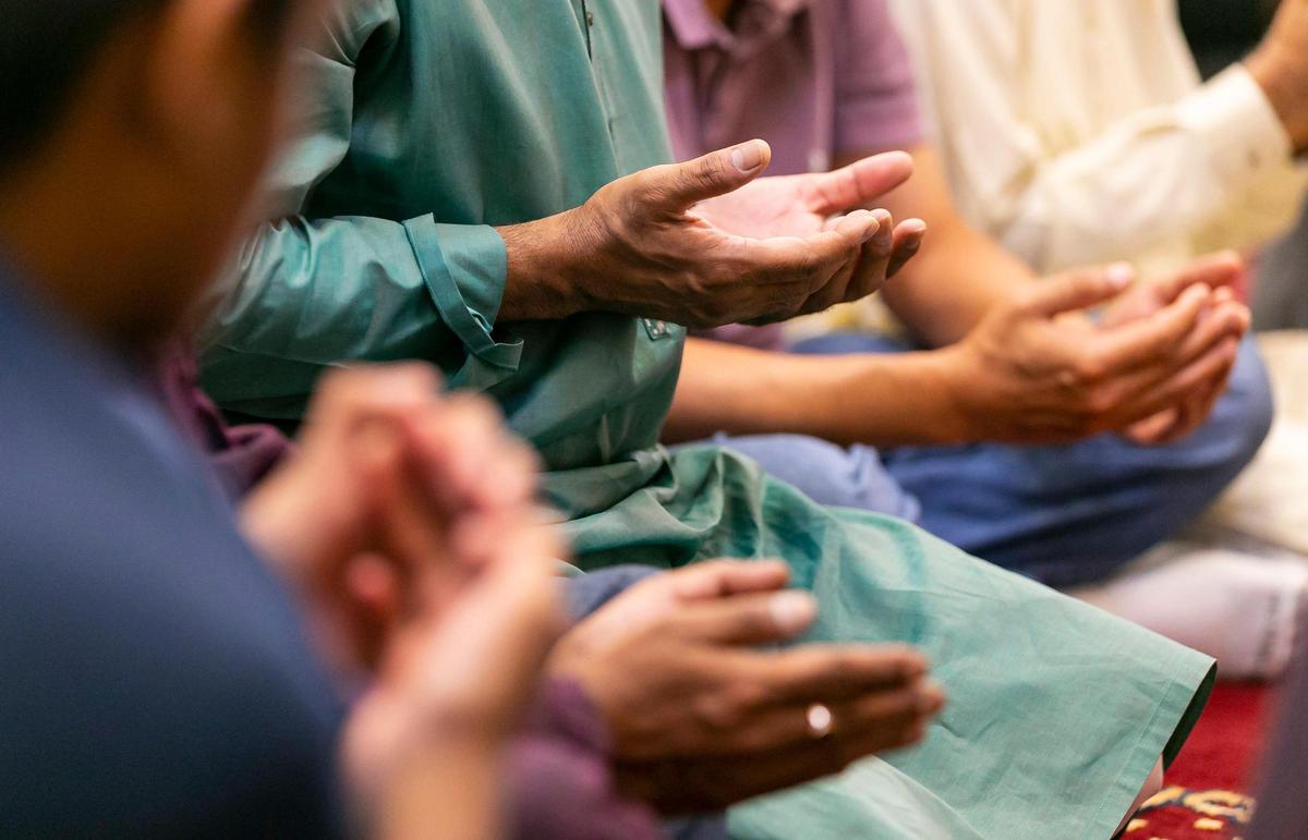 People perform the Eid al-Adha prayer at the Islamic Center of Greater Miami on Saturday, July 9, 2022, in Miami Gardens, Fla.