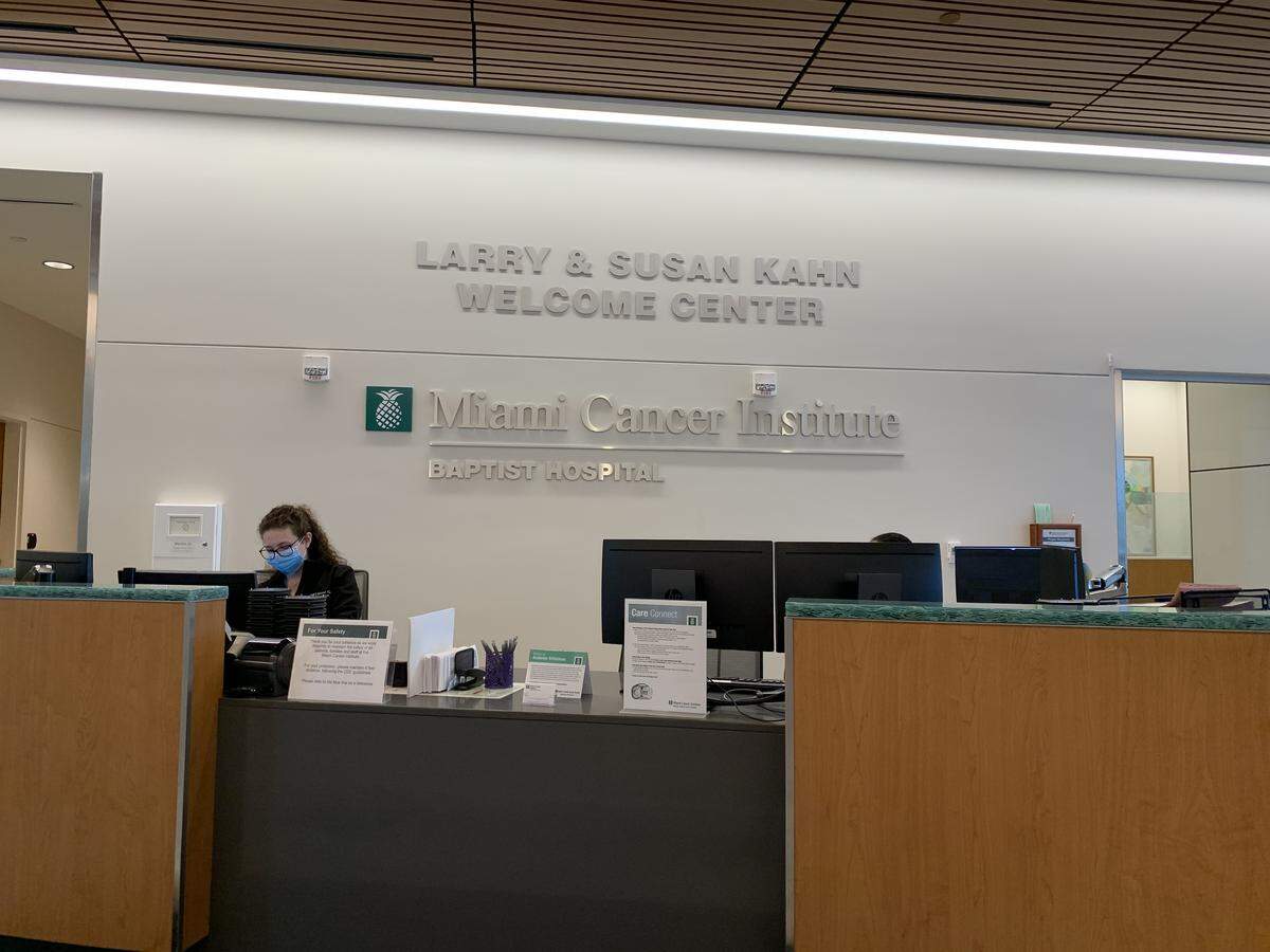 Patients visiting the Miami Cancer Institute on the grounds of Baptist Hospital in Kendall must stand at least six feet away from receptionists when checking in for appointments as seen on May 4, 2020. Floors are marked, staffers wear masks, patients are given temperature readings before entering and visitors are generally not allowed. Valet services are also suspended.