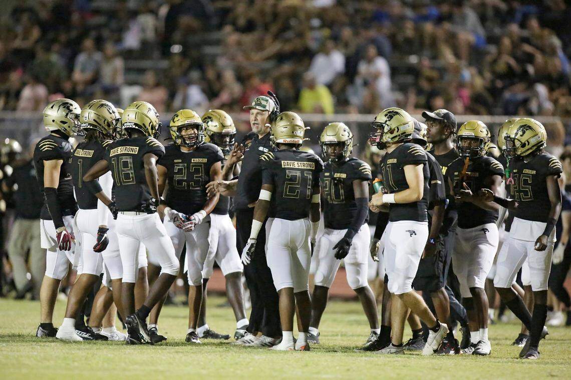 Western Wildcats take a time out during football game against Plantation Colonels on Friday, November 4, 2022 at Western HS in Davie. Andrew Uloza / for Miami Herald