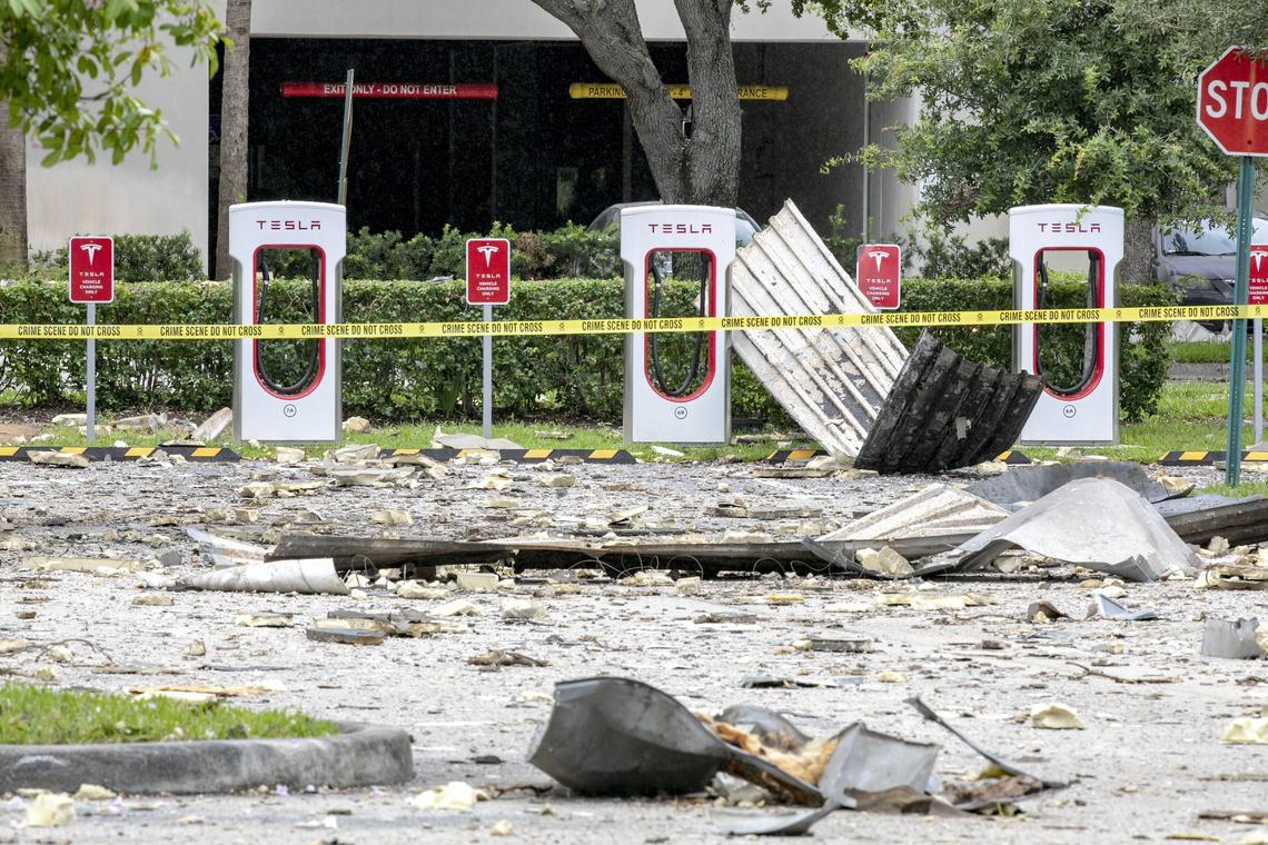 Debris is strewn about the parking lot in the Fountains Plaza, across the street from the site of the explosion that took place yesterday, in Plantation, Florida on Sunday July 7, 2019.