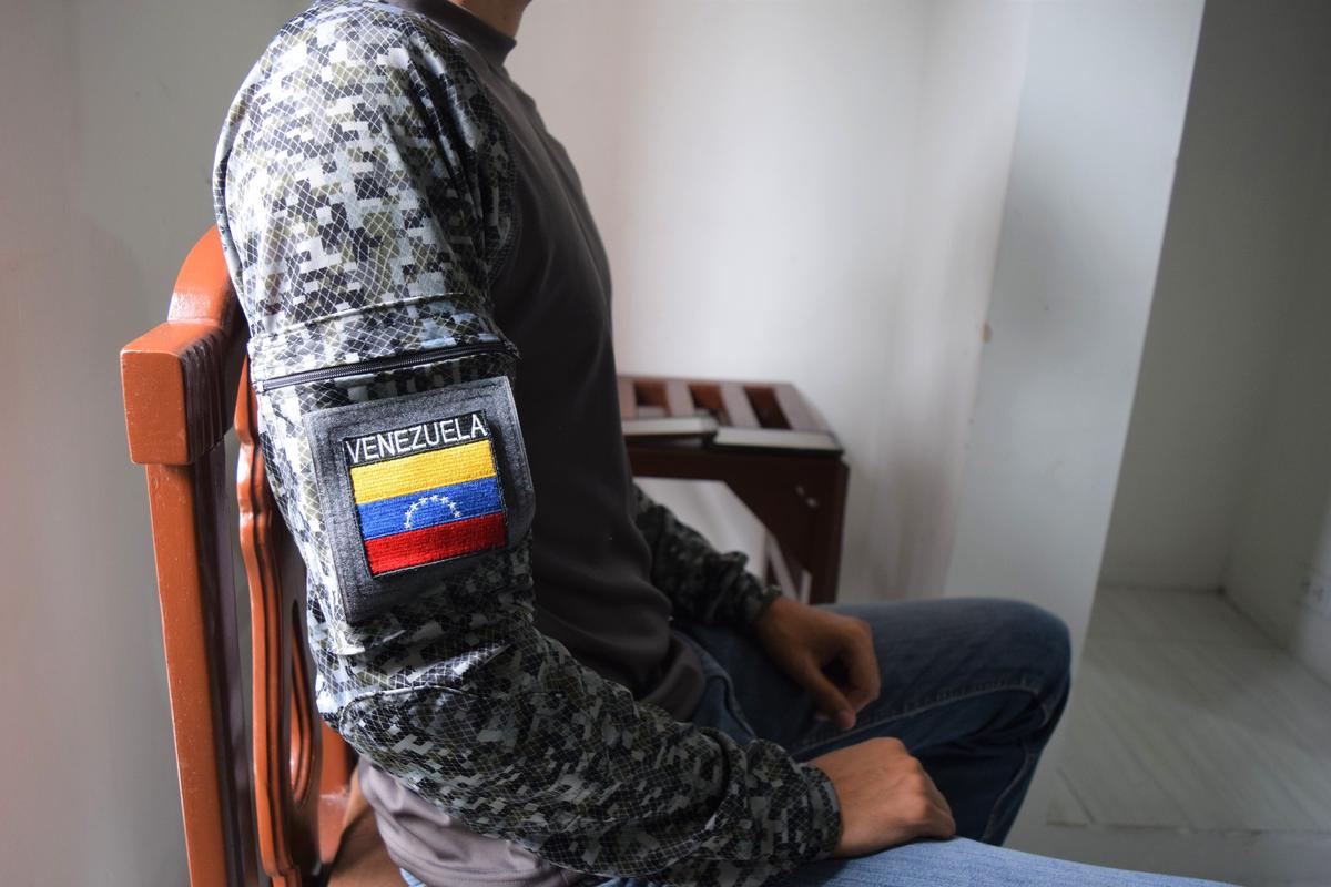 A former Venezuelan police officer poses in Cúcuta, Colombia. More than 1,400 Venezuelan security forces and their families broke ranks with Nicolás Madruo in February to support interim President Juan Guaidó. Now they’re stuck in Colombia, unable to go home and unable to work.