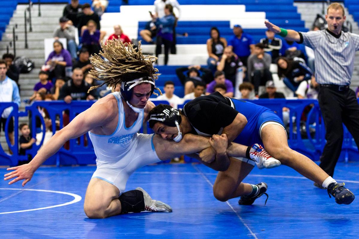 South Dade’s Ansel Cervantes attemtps to pin Miami Palmetto’s Richard Alexander during the 2023 Boys GMAC Wrestling 195 weight class championship finals at South Dade Senior High School in Homestead, Florida, on Saturday, February 4, 2023.