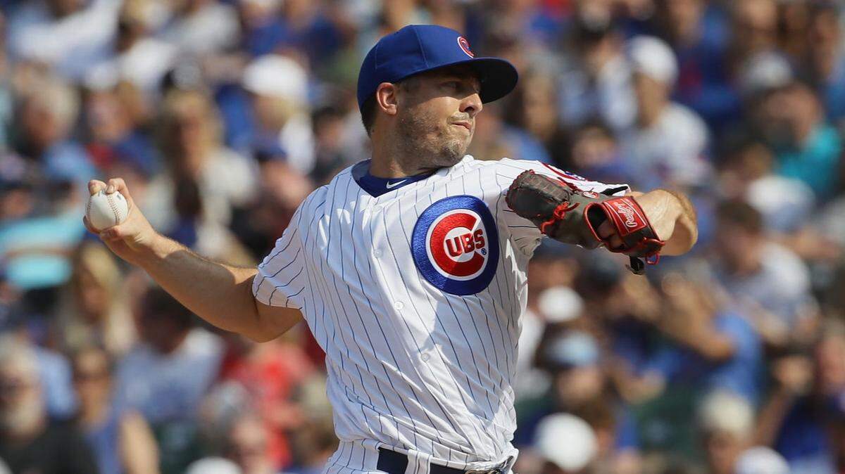 Brandon Kintzler #20 of the Chicago Cubs pitches in the 8th inning against the Washington Nationals at Wrigley Field on August 10, 2018 in Chicago, Illinois. The Cubs defeated the Nationals 3-2.