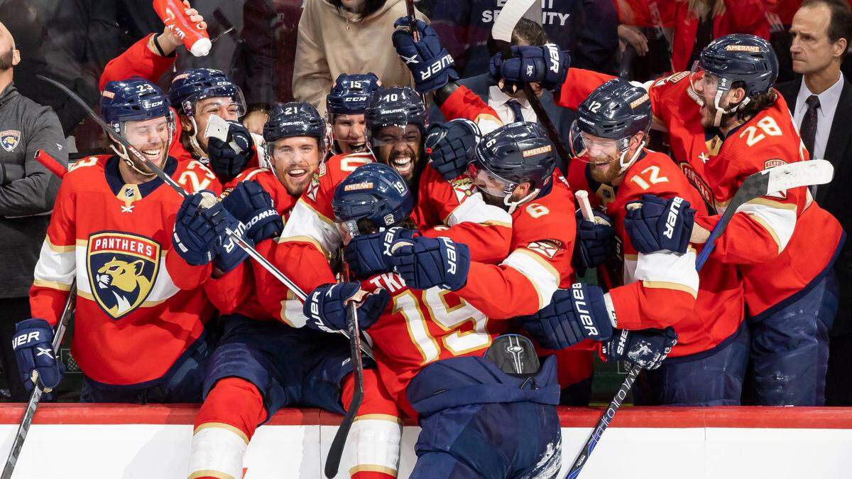 Florida Panthers left wing Matthew Tkachuk (19) celebrates with his teammates after scoring a goal against the Carolina Hurricanes in the third period of Game 4 of the NHL Stanley Cup Eastern Conference finals series at the FLA Live Arena on Wednesday, May 24, 2023 in Sunrise, Fla.