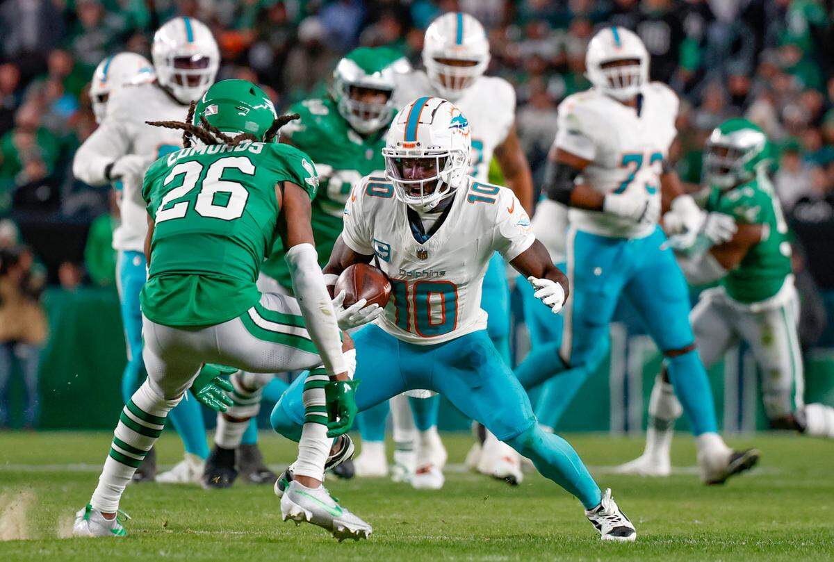 Miami Dolphins wide receiver Tyreek Hill (10) attempts to evade Philadelphia Eagles safety Terrell Edmunds (26) in the first half at Lincoln Financial Field, Philadelphia, PA on Sunday, October 22, 2023.