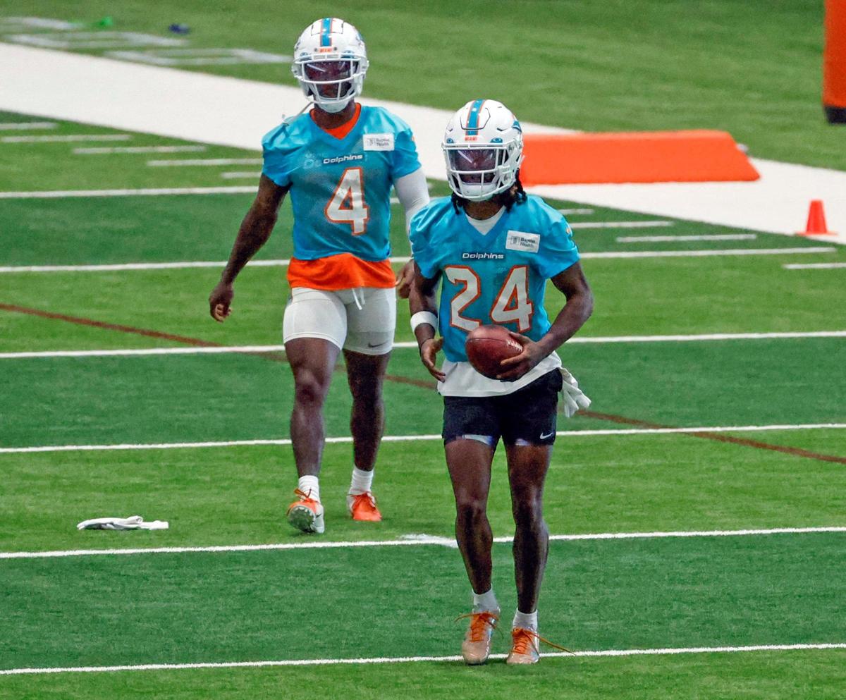 Miami Dolphins cornerbacks Kader Kohou (4) and Cam Smith (24) between drills at practice at the Baptist Health Training Complex in Miami Gardens, Florida on Friday, July 28, 2023.