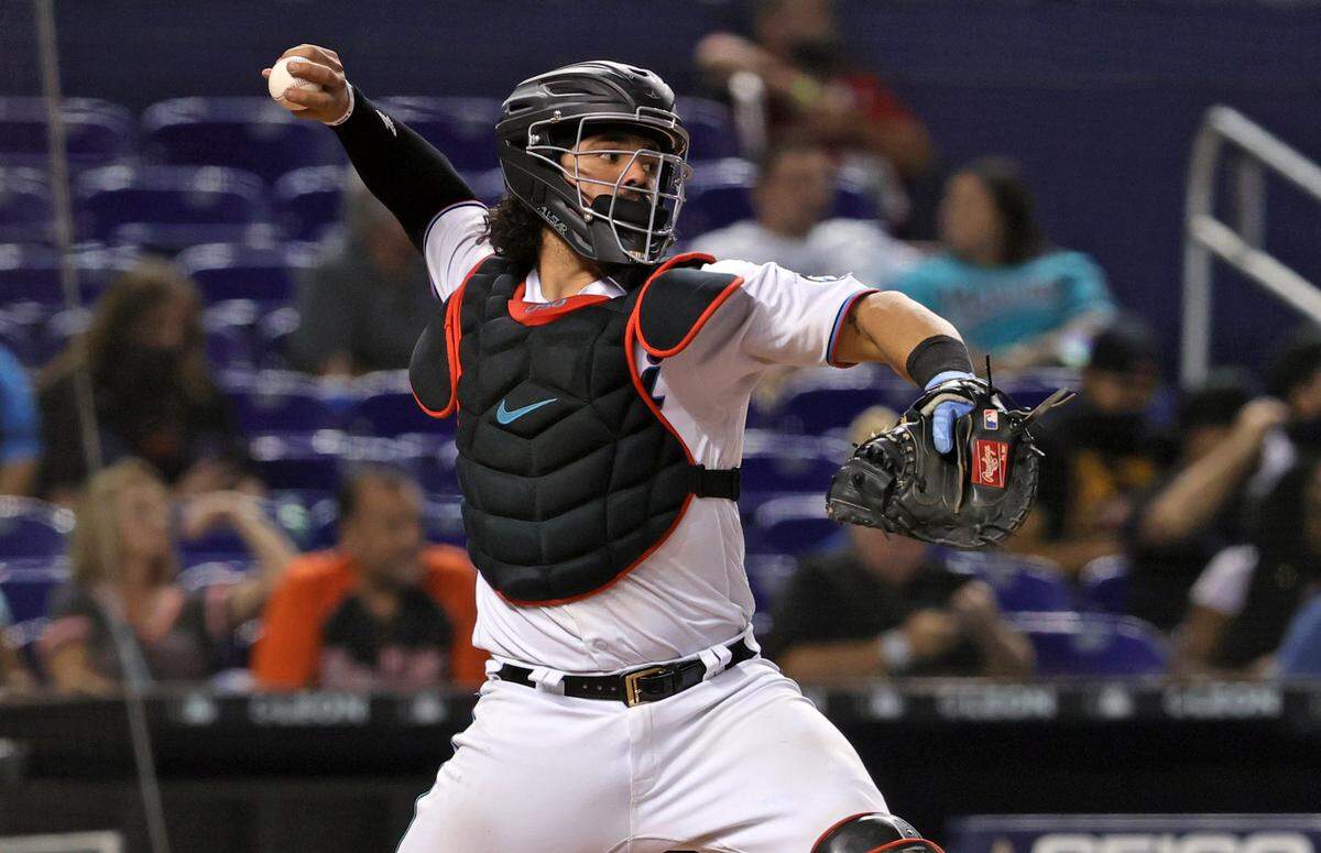 Miami Marlins catcher Jorge Alfaro (38) throws to second base while warming up before the start of ninth inning of their baseball game against the Washington Nationals at loanDepot park on Thursday, August 26, 2021 in Miami, Florida.