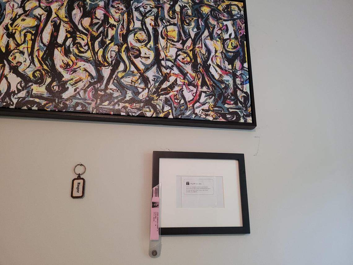 A note attached to a gift sent by famous whistleblower Daniel Ellsberg hangs on Rebekah Jones’ bedroom wall.