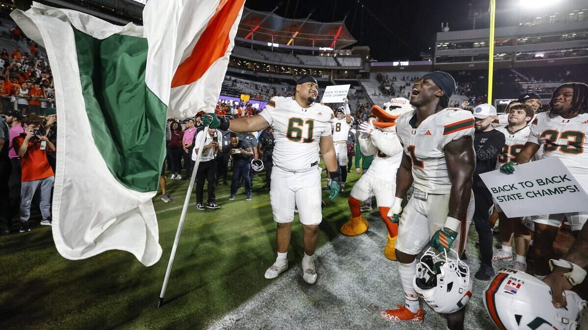 Miami Hurricanes celebrate after defeating the Florida State Seminoles during their NCAA game at Doak Campbell Stadium in Tallahassee, Florida, on Saturday, October 4, 2025.