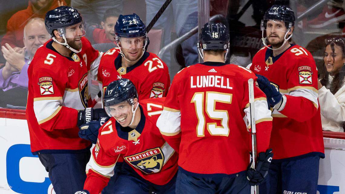 Florida Panthers center Evan Rodrigues (17) celebrates with his teammates after scoring against the Dallas Stars in the third period of their NHL game at the Amerant Bank Arena on Wednesday, Dec. 6, 2023, in Sunrise, Fla.