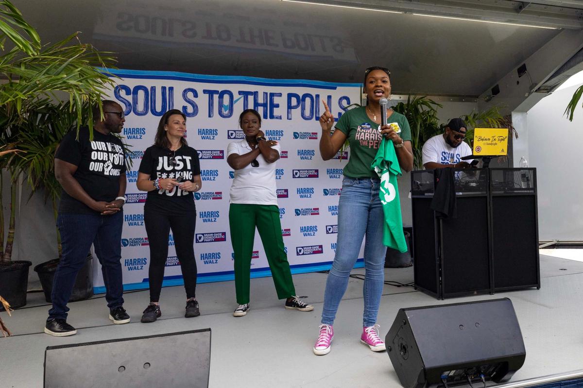 Member of the Florida House of Representatives Ashley Gantt speaks to voters during a Souls to the Polls event on the last day of early voting outside North Dade Regional Library on Sunday, Nov. 3, 2024, in Miami Gardens, Fla.