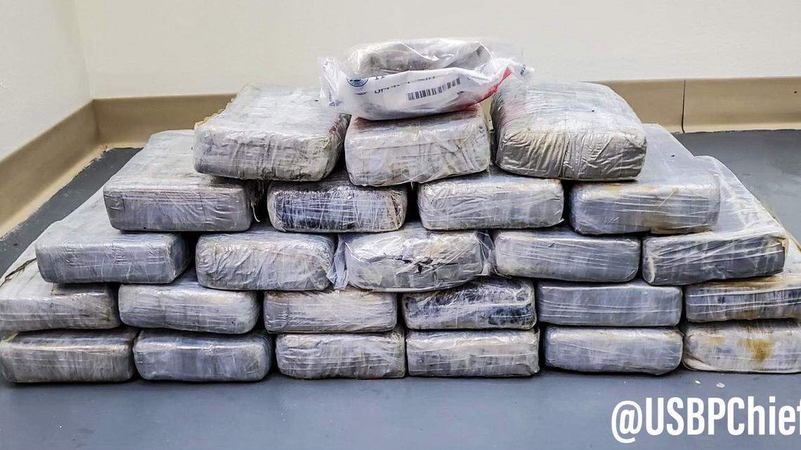 Bricks of cocaine are displayed on the floor. The drugs were found at sea off the Flordida Keys Saturday, Dec. 4, 2021, according to the U.S. Border Patrol.