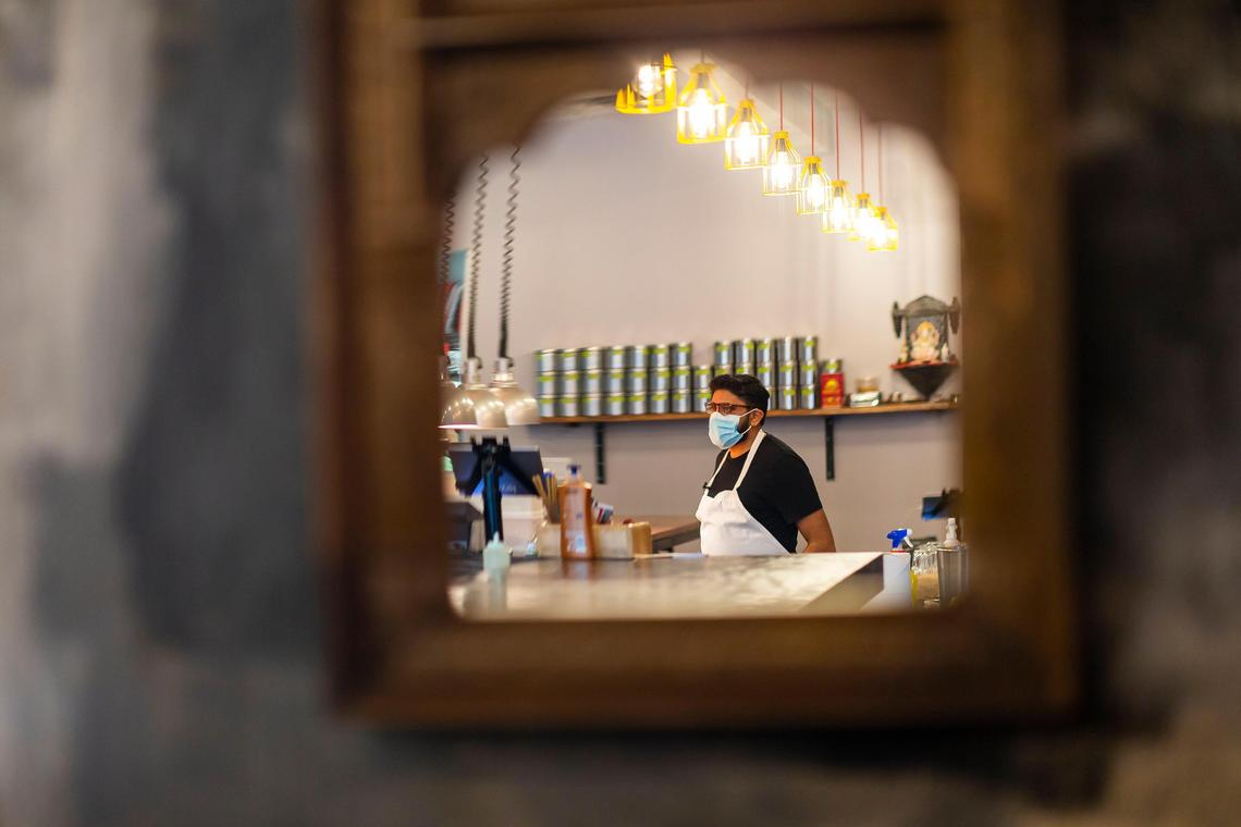 Niven Patel, the owner of Ghee Indian Kitchen, inspects every dish before it is served to guests. When longtime regulars arrived after closing time, he let them in and turned the stove back on to cook.