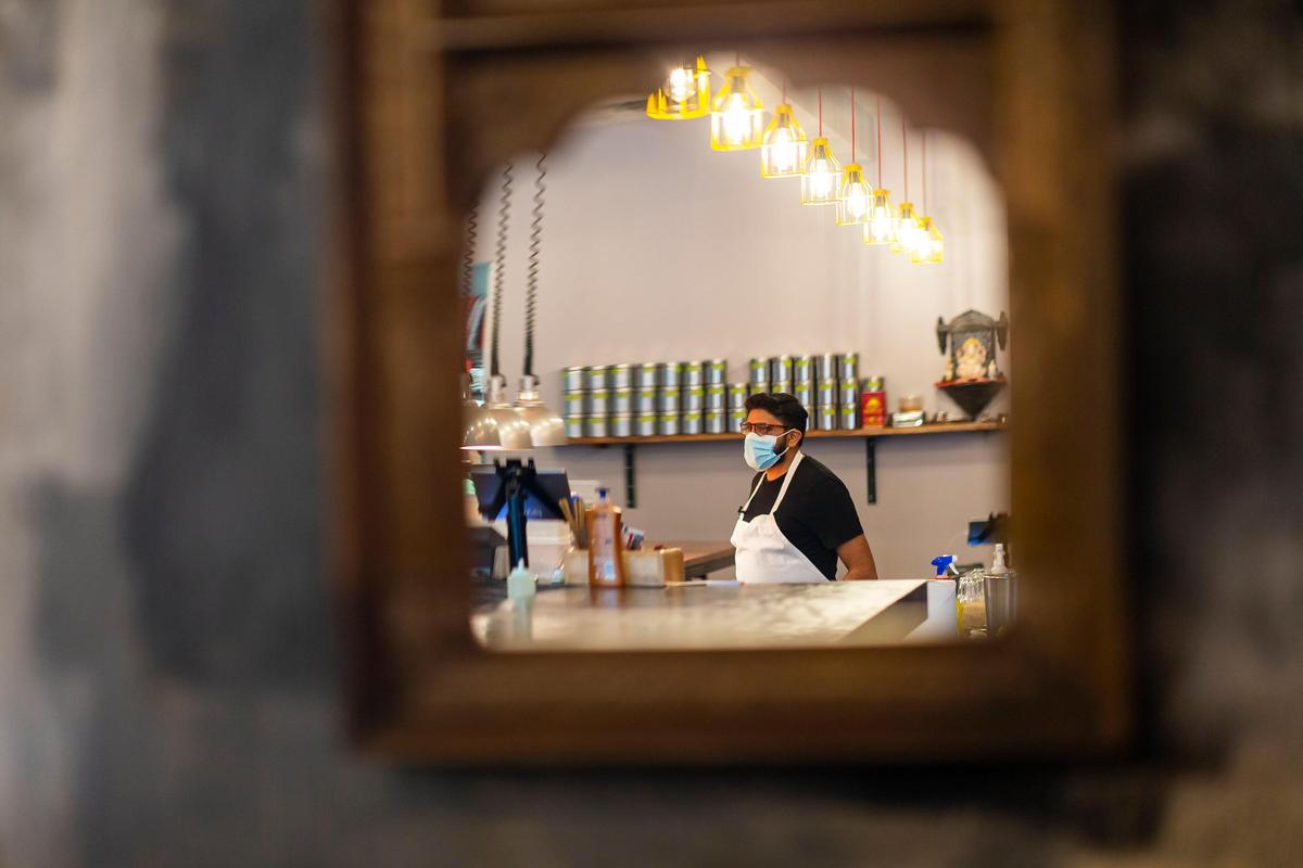Niven Patel, the owner of Ghee Indian Kitchen, inspects every dish before it is served to guests. When longtime regulars arrived after closing time, he let them in and turned the stove back on to cook.