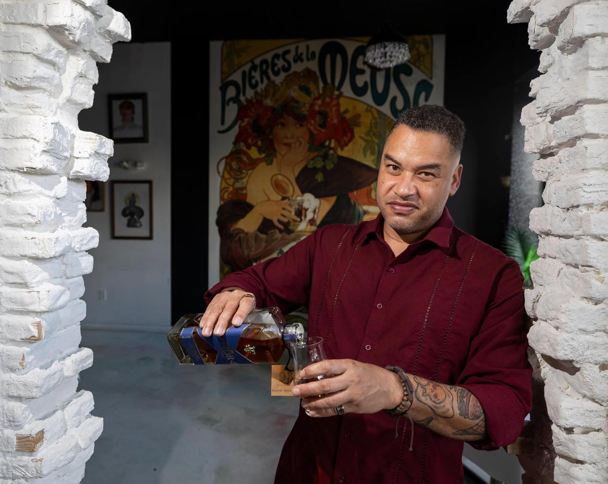 Retired U.S. Marine Maj. Eric Dominijanni is photographed pouring his Fior scotch on Wednesday, Nov. 13, 2024, in Miami.