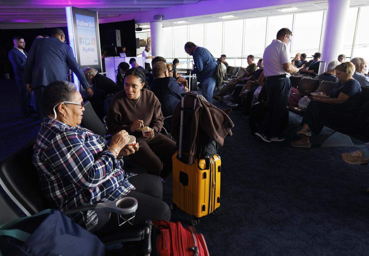 Rose Chastanet, left, and her daughter Rosanne wait for their flight on Icelandair during a ceremony introducing the only direct flight between Miami and Iceland on Sunday, Oct. 26, 2025, at Miami International Airport in Miami, Fla.