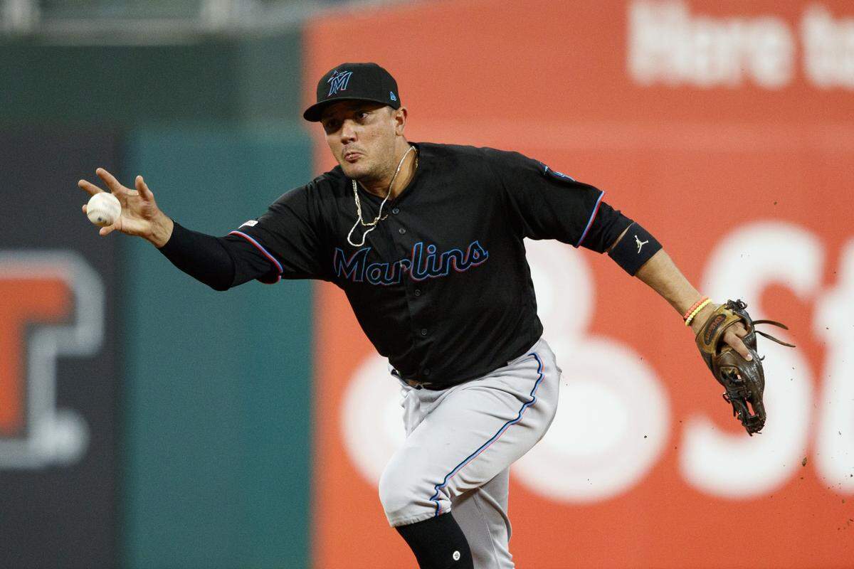 Miami Marlins shortstop Miguel Rojas grabs a single by Philadelphia Phillies’ Brad Miller during the first inning of a baseball game, Friday, Sept. 27, 2019, in Philadelphia. (AP Photo/Matt Slocum)