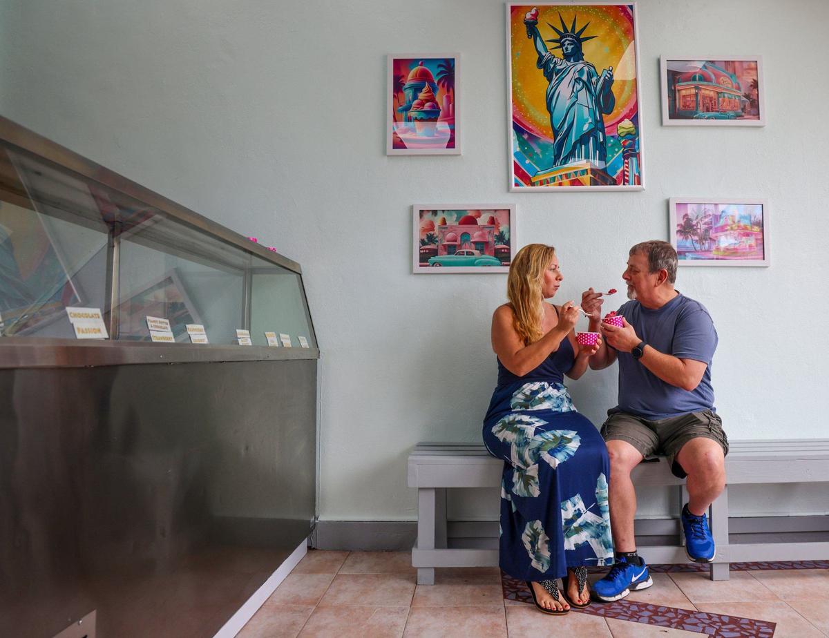 Vicky and Sam Brejt sample each other’s ice cream at The Ice Cream Factory in Miami Beach. The shop serves ice cream and non-dairy sorbet.