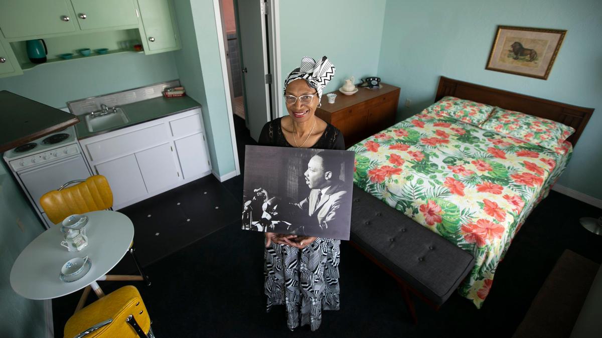 The president/CEO of the Historic Hampton House, Charlayne W. Thompkins, holds a photograph of Martin Luther King Jr. while standing inside one of his favorite rooms at the Hampton House in Miami. It is said that King gave one of the early versions of his pivotal ‘I Have a Dream’ speech at the Hampton House.