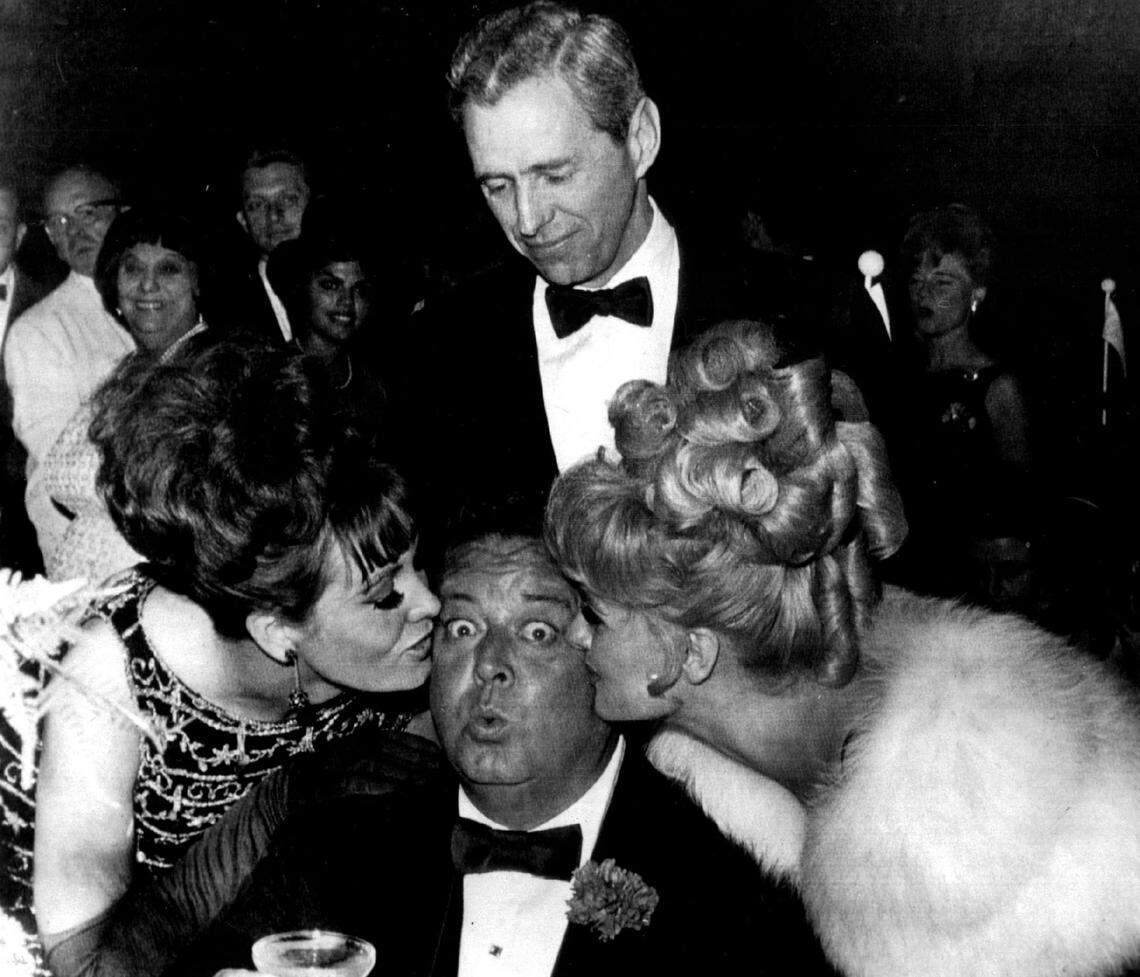 Jackie Gleason gets some love during his birthday party in Miami Beach in 1965.