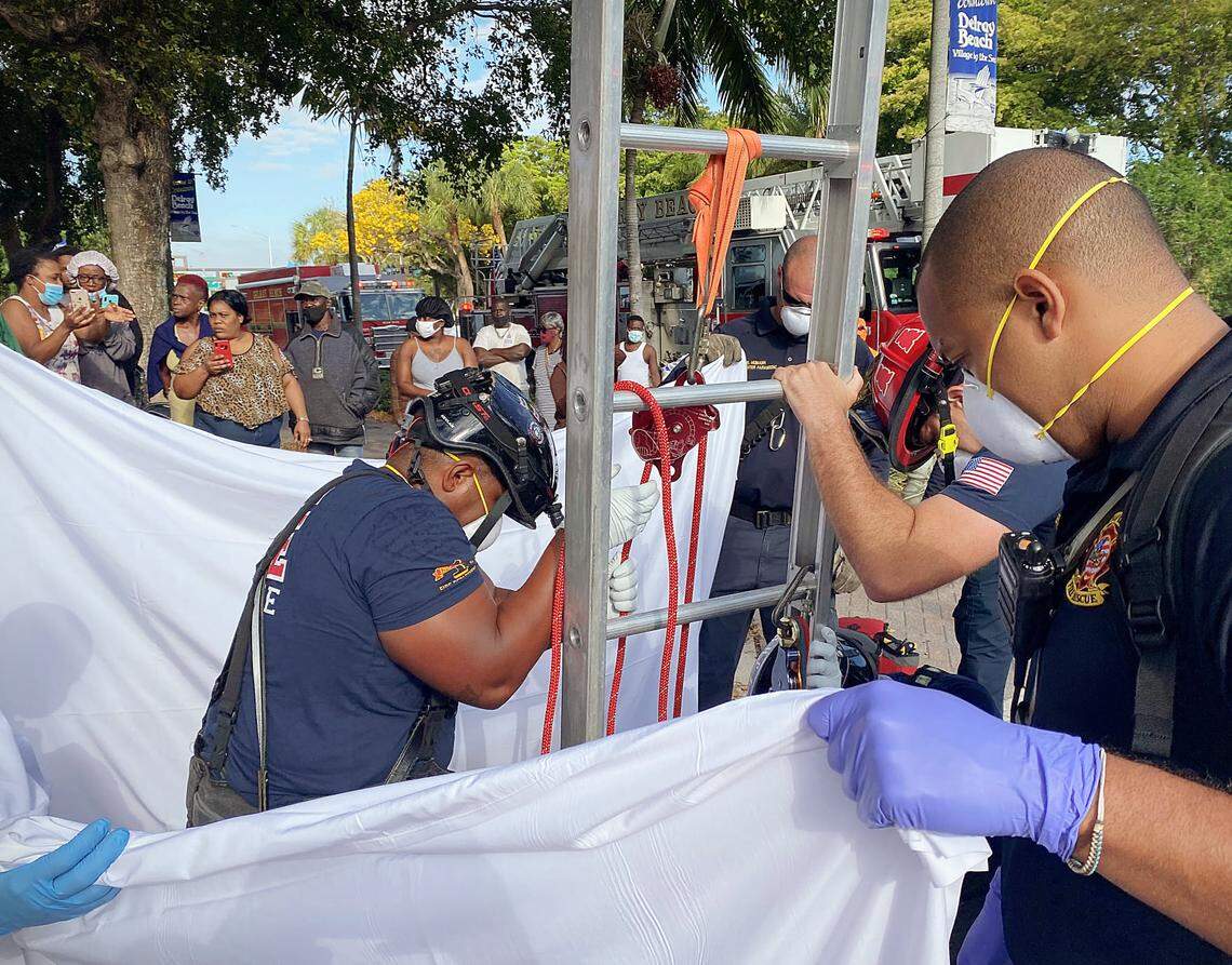 Crews used a ladder and harness to pull the naked woman out of the drain, which is about 8-feet deep, fire rescue said.