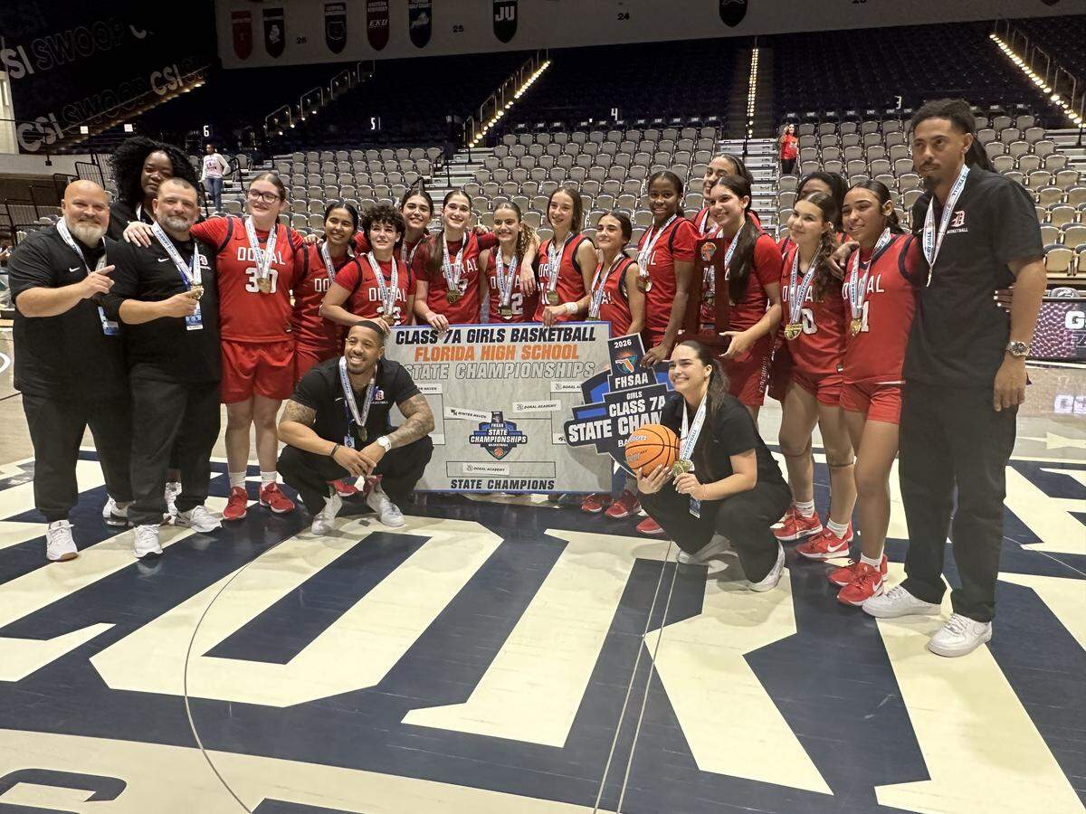 The Doral Academy girls’ basketball team celebrates their first ever state championship after beating Winter Haven 48-43 on Saturday, March 14, 2026 at UNF Arena in Jacksonville, Fla.
