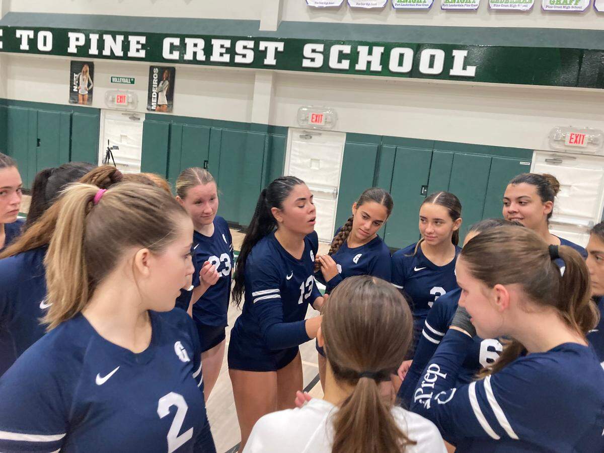 Gulliver volleyball senior Julie Rose-Rivera (middle) fires up her teammates during Tuesday’s victory over Pine Crest in the Region 4-3A final in Fort Lauderdale, Fla.