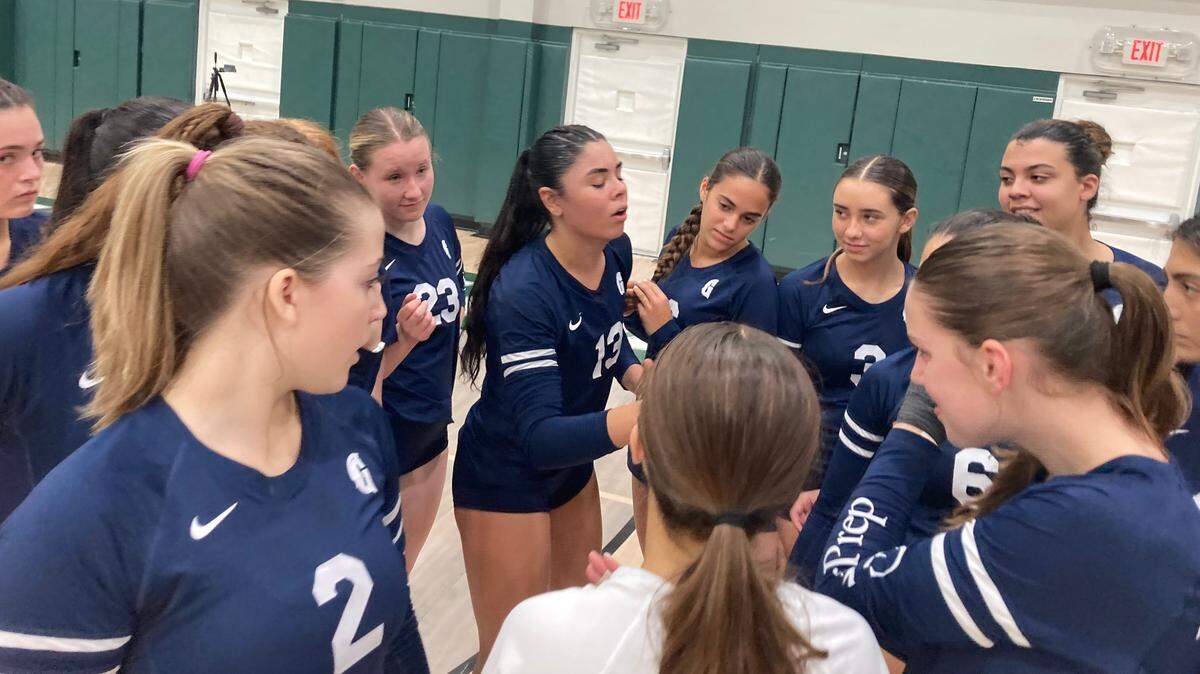 Gulliver volleyball senior Julie Rose-Rivera (middle) fires up her teammates during Tuesday’s victory over Pine Crest in the Region 4-3A final in Fort Lauderdale, Fla.
