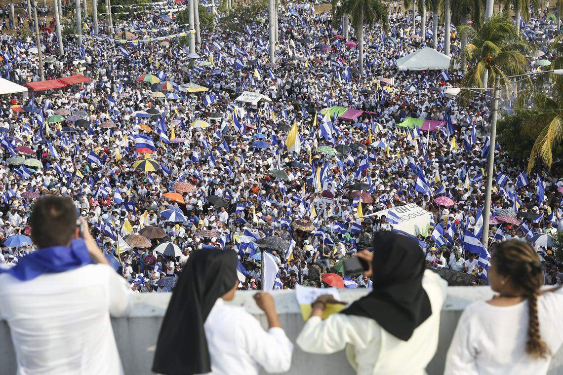 Thousands of people gather outside Managua's Cathedral during Saturday's massive march called by the Catholic Church as a day of prayer, in Managua, Nicaragua.