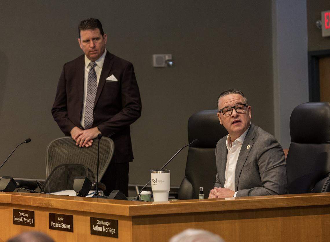 City Attorney George K. Wysong III (left) listens as City of Miami manager Arthur Noriega announced the cancellation of the special meeting called due to the lack of quorum, to send two referendums to the November ballot, at City Hall, on Friday September 05,2025.