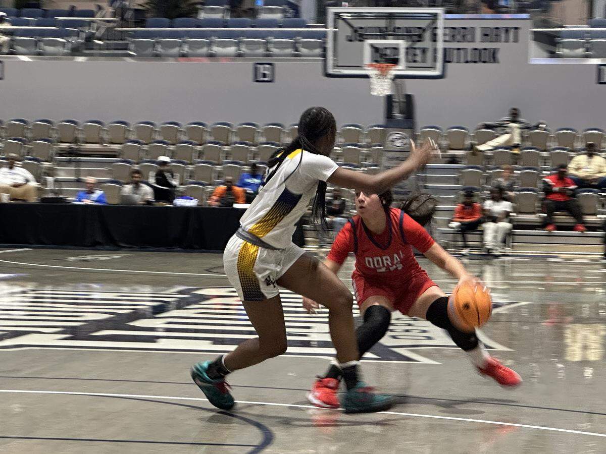 Doral Academy guard Stephanie Vega puts a crossover move on a Winter Haven defender during Saturday’s Class 7A girls’ basketball state championship game at UNF Arena in Jacksonville, Fla.